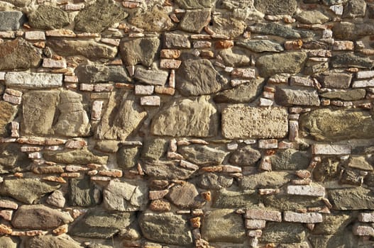 Old stone wall with some bricks in Portugal