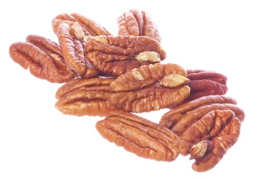 Isolated macro image of pecan nuts.