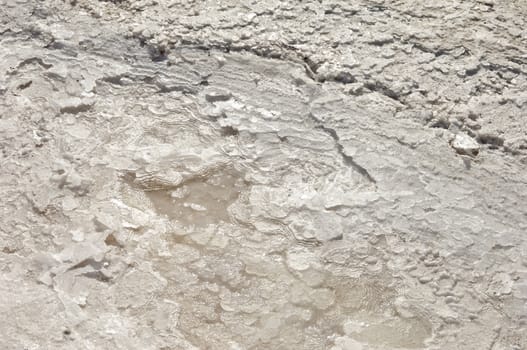 Crystallized salt in an evaporation pond, Algarve, Portugal