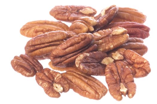 Isolated macro image of pecan nuts.