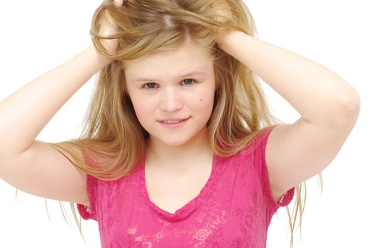 young blonde woman rumples tresses hair on white 