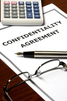 Image of a confidentiality agreement on an office table.