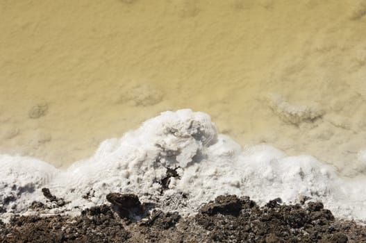 Crystallized salt in an evaporation pond, Algarve, Portugal