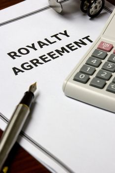 Image of a royalty agreement on an office table.
