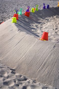 Colorful beach toys lay in the sand for kids to play with on Miami's beautiful South Beach.