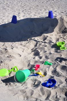 Colorful beach toys lay in the sand for kids to play with on Miami's beautiful South Beach.