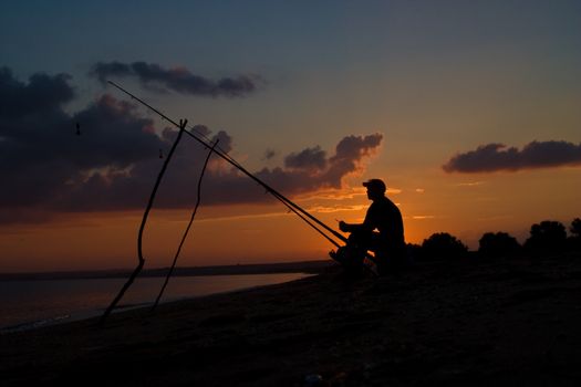 people series: fisherman sit on the beach of sea