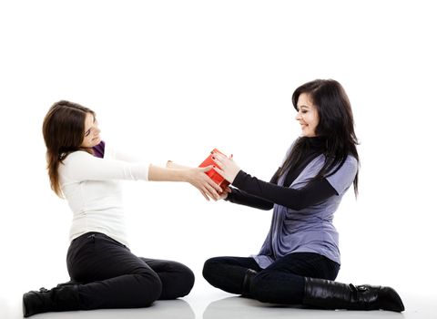 Beautiful young woman giving and receive a gift