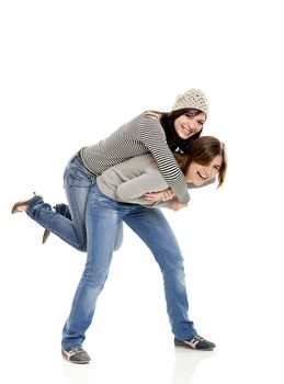 Two beautiful happy young woman isolated on white