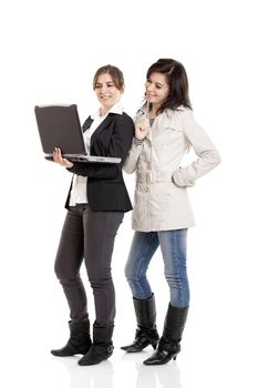 Two female young students watching something on a laptop