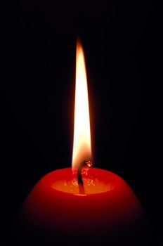 Image shows a red egg-shaped decorative candle 