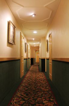 hotel corridor with lamps on the ceiling