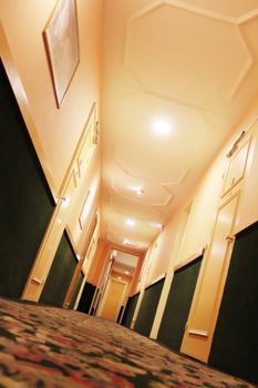 hotel corridor with lamps on the ceiling