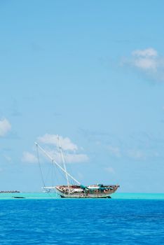 beautiful photo of a semi-submerged and rusted shipwreck
