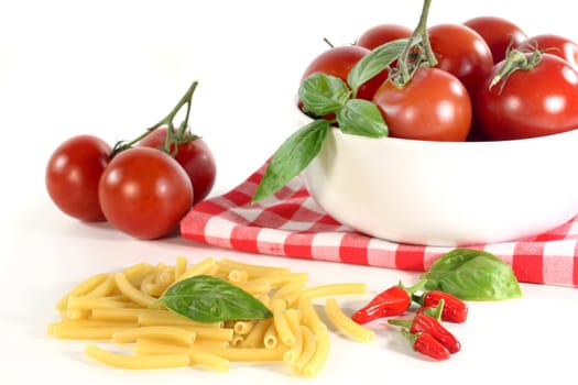 pasta tomato and basil on a white background