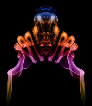 Symmetric colorful pattern created with smoke, it can be used well as an abstract background or blend.