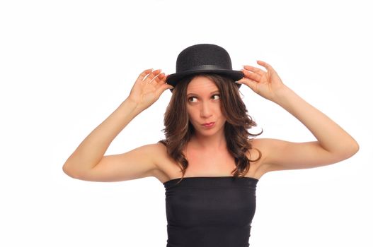 a young woman being silly with a derby hat on a white background