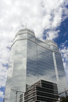 A large glass building with two white spires