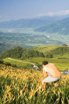 It is a cameraman stand on the tiger lily farm.