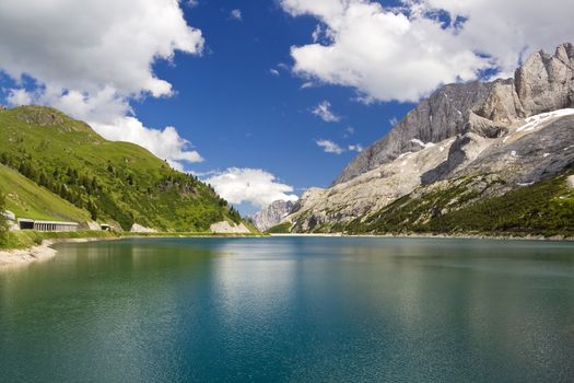 The artificial lake and pass of Fedaia (Dolomites, Trentino, Italy), at summer
