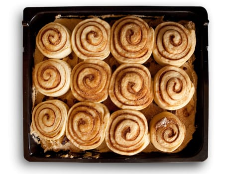 A pan of uncooked cinnamon buns ready for the oven