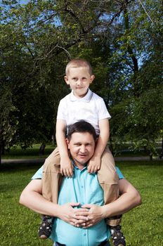 The portrait of the father and the son, in park together