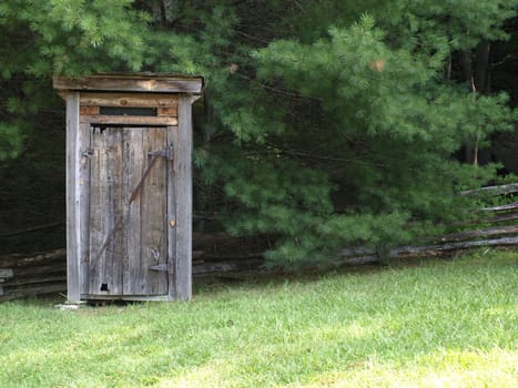 Old wooden outhouse on a rural farm