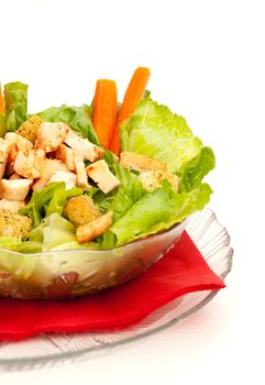 Chicken Caesar Salad with grilled chicken isolated on white