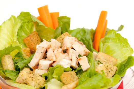 Chicken caeser salad isolated on a white background