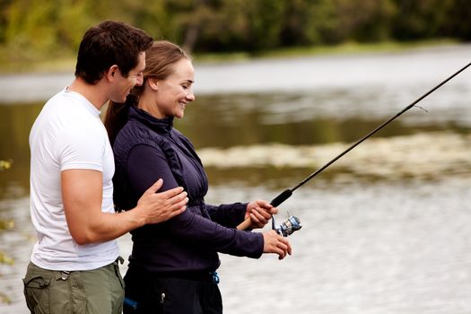 A woman fishing on a interior forest lake