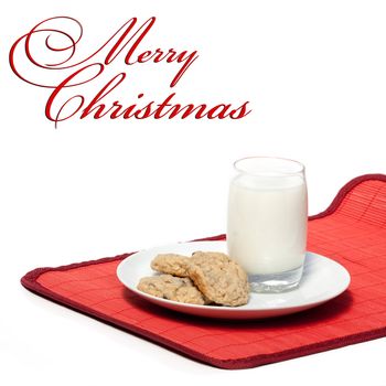 Milk and cookies - a typical christmas snack with a Merry Christmas copy space