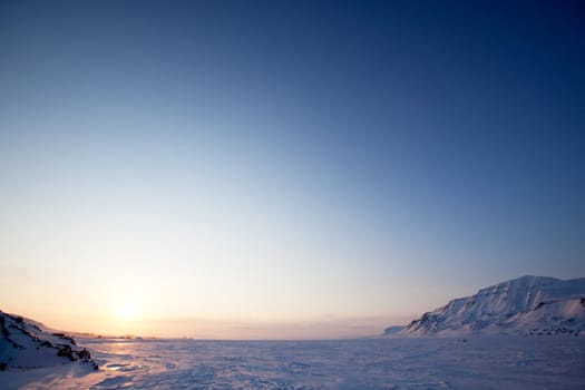 A landscape on the island of Spitsbergen, Svalbard, Norway late at night. View from Longyearbyen.