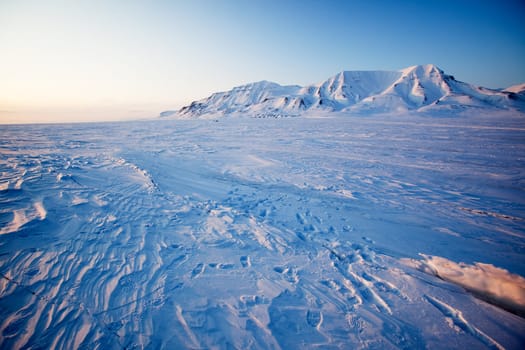 A landscape on the island of Spitsbergen, Svalbard, Norway late at night. View from Longyearbyen.