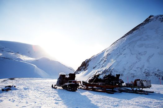 A snowmobile on a beautiful winter mountain landscape