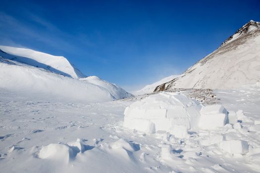 Igloo in a winter mountain setting