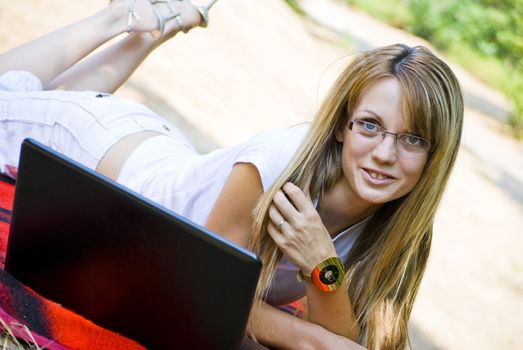 beautiful young woman working out with laptop or notebook