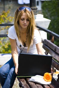 beautiful young woman working out with laptop or notebook