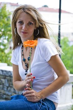 beautiful young blonde woman with flower