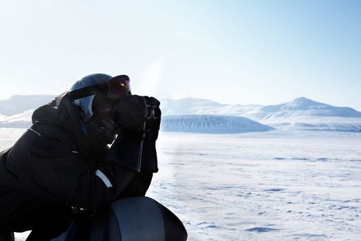 A winter adventure guide looking out on the horizon