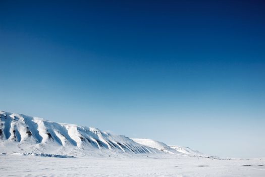 A winter mountain landscape of the island of Spitsbergen, Svalbard, Norway