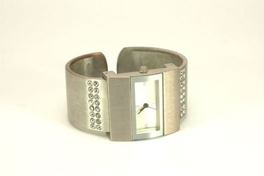 wrist metallic watches with encrustation stone on the white background