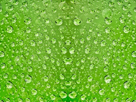 Abstract background - a drop of water on a green