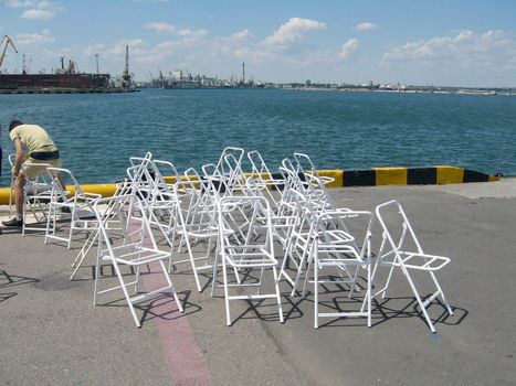 chairs on painting on moorage in the Odessa bay