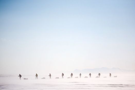 A group of people on a winter expedition in a snow storm