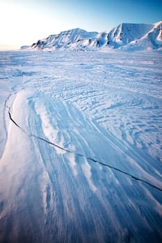 A landscape on the island of Spitsbergen, Svalbard, Norway late at night. View from Longyearbyen.