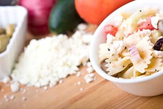 a fresh greek bow-tie pasta salad served cold
