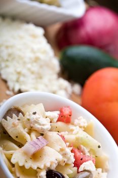 a fresh greek bow-tie pasta salad served cold