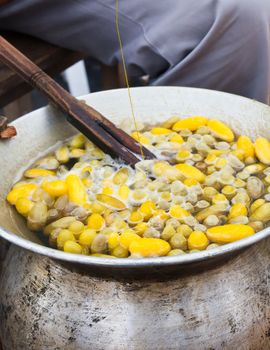 Boiling cocoon in a pot to prepare a cocoon silk