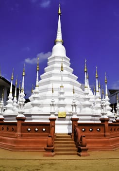 A white wat in Chiang Mai, Thailand with red stairs