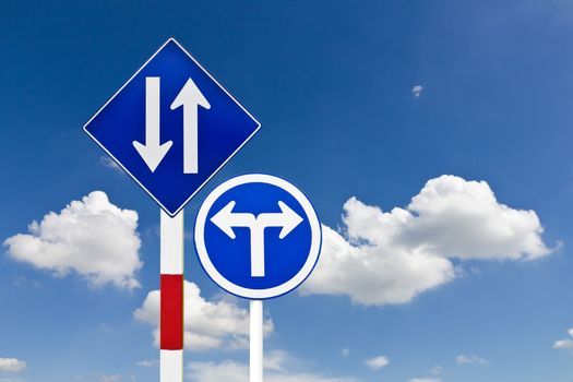 Curved Road Traffic Sign over blue sky